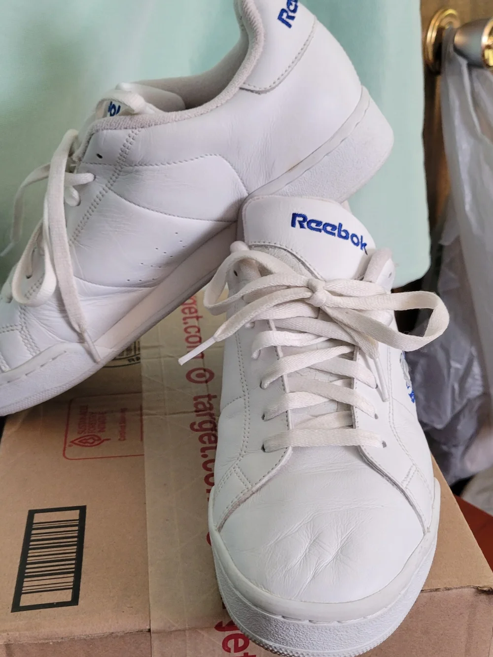 Reebok Men’s Classic White Leather Sneakers with Blue Accents